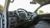 Used 2022 Nissan Urvan Standard Roof in White – Driver Side Dashboard & Steering View for Sale at First Choice Cars Dubai Sharjah