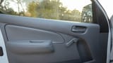 Used 2022 Nissan Urvan Standard Roof in White – Driver Door Panel Full View for Sale at First Choice Cars Dubai Sharjah