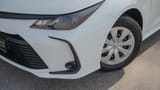 Used 2024 Toyota Corolla XLI in White – Headlight Close-up for Sale at First Choice Cars Dubai Sharjah