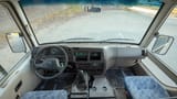 Used 2023 Mitsubishi Rosa Standard in White – Front Cabin / Dashboard Full View for Sale at First Choice Cars Dubai Sharjah