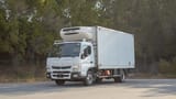 Used 2022 Mitsubishi Canter Chiller Box in White – Left Front Diagonal (45°) View for Sale at First Choice Cars Dubai Sharjah