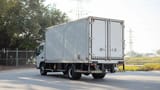 Used 2022 Mitsubishi Canter Chiller Box in White – Left Back Diagonal (45°) View for Sale at First Choice Cars Dubai Sharjah