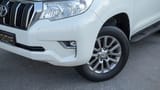 Used 2019 Toyota Prado EXR in White – Headlight Close-up for Sale at First Choice Cars Dubai Sharjah