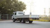 Used 2024 Mitsubishi Canter Double Cabin Cargo Body in White – Left Back Diagonal (45°) View for Sale at First Choice Cars Dubai Sharjah