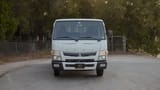 Used 2024 Mitsubishi Canter Double Cabin Cargo Body in White – Front View for Sale at First Choice Cars Dubai Sharjah