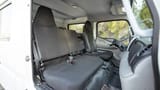 Used 2024 Mitsubishi Canter Double Cabin Cargo Body in White – Front Passenger Side Cabin View for Sale at First Choice Cars Dubai Sharjah