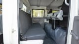 Used 2024 Mitsubishi Canter Double Cabin Cargo Body in White – Rear Passenger Side Cabin View for Sale at First Choice Cars Dubai Sharjah