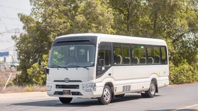 Used 2020 Toyota Coaster Bus White – Left Front Diagonal (45°) View at First Choice Cars Sharjah