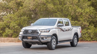 Used 2024 Toyota Hilux DLX Double Cabin White – Left Front Diagonal (45°) View at First Choice Cars Sharjah