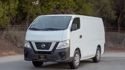 Used 2021 Nissan Urvan Standard Roof White – Left Front Diagonal (45°) View at First Choice Cars Sharjah