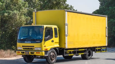 Used 2016 Isuzu FSR Cargo Body Yellow – Left Front Diagonal (45°) View at First Choice Cars Sharjah