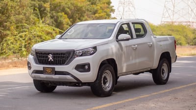 Used 2023 Peugeot Landtrek Double Cabin White – Left Front Diagonal (45°) View at First Choice Cars Sharjah