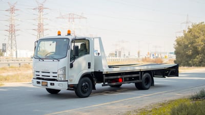 Used 2017 Isuzu NPR Recovery Truck White – Left Front Diagonal (45°) View at First Choice Cars Sharjah
