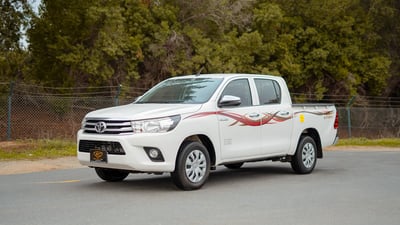 Used 2021 Toyota Hilux GLX Double Cabin White – Left Front Diagonal (45°) View at First Choice Cars Sharjah