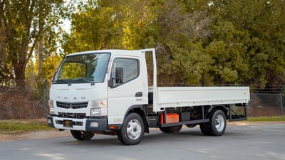 Used 2023 Mitsubishi Canter Cargo Body White – Left Front Diagonal (45°) View at First Choice Cars Sharjah