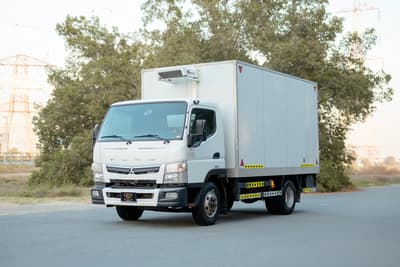 Used 2020 Mitsubishi Canter Chiller Box in White – Left Front Diagonal (45°) View for Sale at First Choice Cars Dubai Sharjah