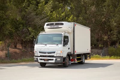 Used 2020 Mitsubishi Canter Freezer Box in White – Left Front Diagonal (45°) View for Sale at First Choice Cars Dubai Sharjah