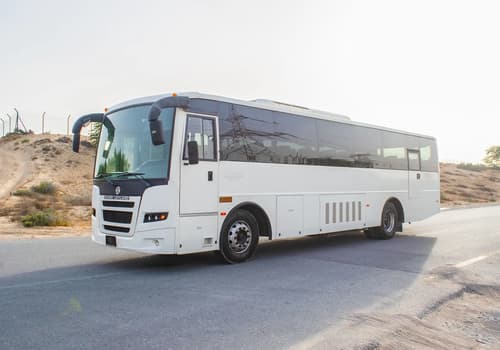 Used 2016 Ashok Leyland Falcon Bus 51-Seater White – Left Front Diagonal (45°) View at First Choice Cars Sharjah
