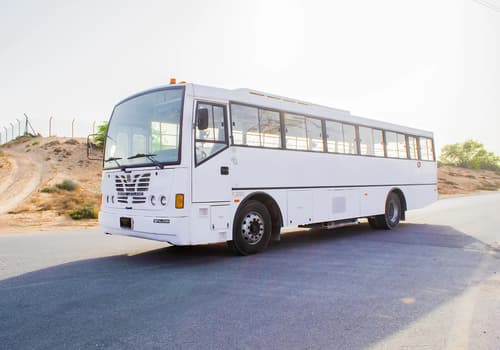 Used 2016 Ashok Leyland Falcon Bus 84-Seater White – Left Front Diagonal (45°) View at First Choice Cars Sharjah