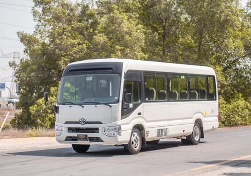Used 2020 Toyota Coaster Bus White – Left Front Diagonal (45°) View at First Choice Cars Sharjah