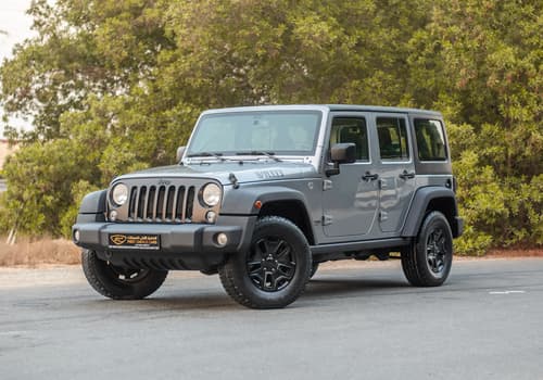 Used 2018 Jeep Wrangler Unlimited Willys Wheeler in Silver – Left Front Diagonal (45°) View for Sale at First Choice Cars Dubai Sharjah
