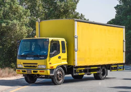 Used 2016 Isuzu FSR Cargo Body in Yellow – Left Front Diagonal (45°) View for Sale at First Choice Cars Dubai Sharjah