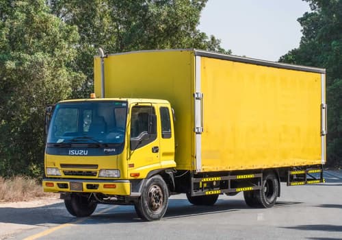 Used 2016 Isuzu FSR Cargo Body in Yellow – Left Front Diagonal (45°) View for Sale at First Choice Cars Dubai Sharjah