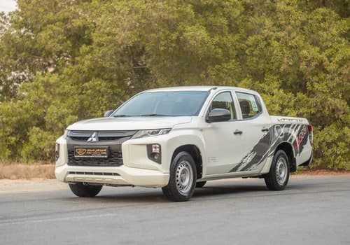 Used 2021 Mitsubishi L200 GL Double Cabin in White – Left Front Diagonal (45°) View for Sale at First Choice Cars Dubai Sharjah