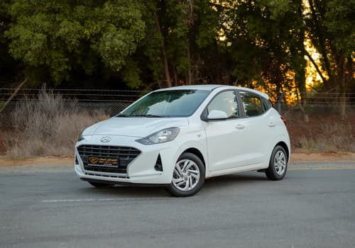 Used 2023 Hyundai Grand i10 Smart White – Left Front Diagonal (45°) View at First Choice Cars Sharjah