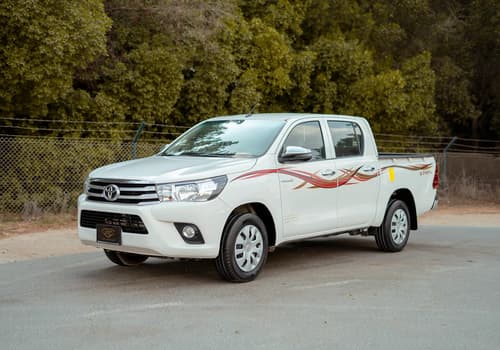 Used 2022 Toyota Hilux GLX Double Cabin White – Left Front Diagonal (45°) View at First Choice Cars Sharjah