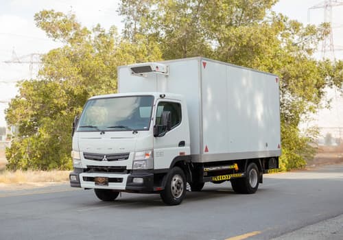 Used 2020 Mitsubishi Canter Chiller Box in White – Left Front Diagonal (45°) View for Sale at First Choice Cars Dubai Sharjah
