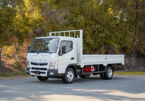 Used 2022 Mitsubishi Canter Cargo Body in White – Left Front Diagonal (45°) View for Sale at First Choice Cars Dubai Sharjah