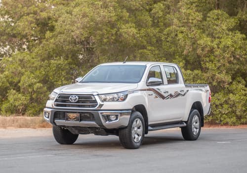 Used 2024 Toyota Hilux GLX Double Cabin White – Left Front Diagonal (45°) View at First Choice Cars Sharjah