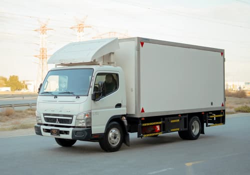 Used 2017 Mitsubishi Canter Chiller Box in White – Left Front Diagonal (45°) View for Sale at First Choice Cars Dubai Sharjah