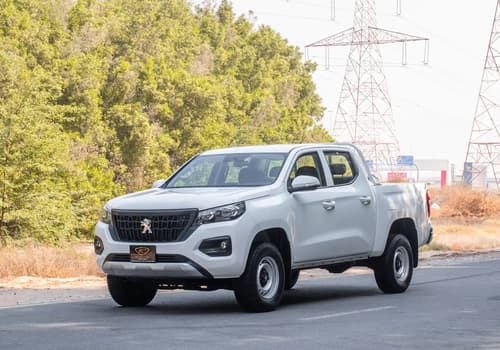 Used 2023 Peugeot Landtrek Double Cabin White – Left Front Diagonal (45°) View at First Choice Cars Sharjah