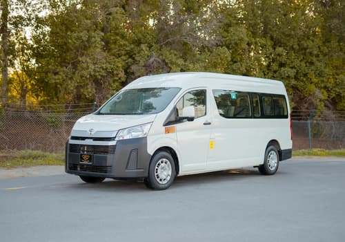 Used 2021 Toyota Hiace GL High Roof in White – Left Front Diagonal (45°) View for Sale at First Choice Cars Dubai Sharjah