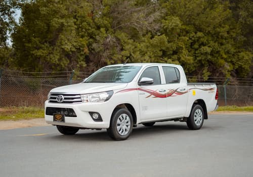 Used 2021 Toyota Hilux GLX Double Cabin White – Left Front Diagonal (45°) View at First Choice Cars Sharjah