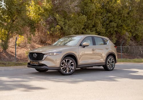 Used 2023 Mazda CX-5 GT in Gold – Left Front Diagonal (45°) View for Sale at First Choice Cars Dubai Sharjah