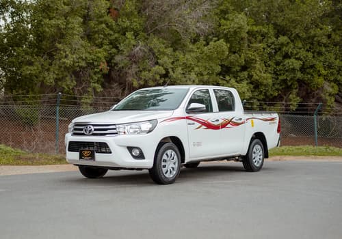 Used 2021 Toyota Hilux GLX Double Cabin White – Left Front Diagonal (45°) View at First Choice Cars Sharjah