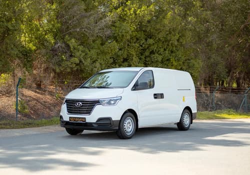 Used 2021 Hyundai H1 Cargo Van in White – Left Front Diagonal (45°) View for Sale at First Choice Cars Dubai Sharjah