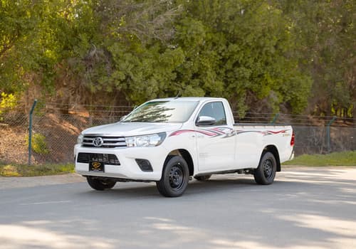 Used 2022 Toyota Hilux GLX Single Cabin in White – Left Front Diagonal (45°) View for Sale at First Choice Cars Dubai Sharjah