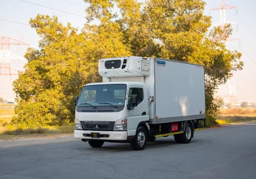 Used 2016 Mitsubishi Canter Freezer Box in White – Left Front Diagonal (45°) View for Sale at First Choice Cars Dubai Sharjah