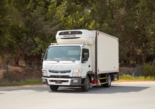 Used 2020 Mitsubishi Canter Freezer Box in White – Left Front Diagonal (45°) View for Sale at First Choice Cars Dubai Sharjah