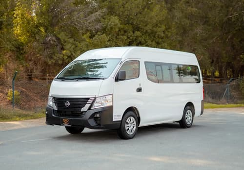Used 2023 Nissan Urvan High Roof in White – Left Front Diagonal (45°) View for Sale at First Choice Cars Dubai Sharjah