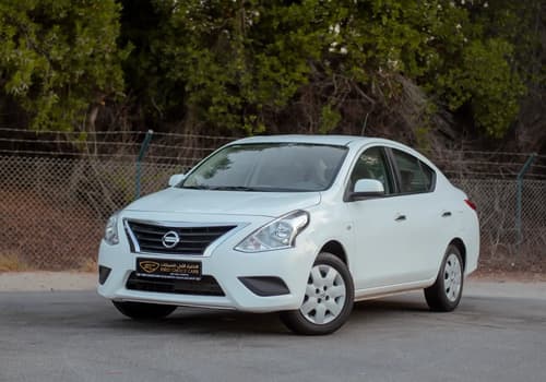 Used 2023 Nissan Sunny SV in White – Left Front Diagonal (45°) View for Sale at First Choice Cars Dubai Sharjah