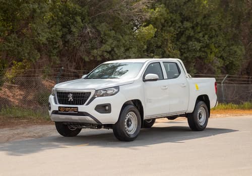 Used 2023 Peugeot Landtrek Double Cabin in White – Left Front Diagonal (45°) View for Sale at First Choice Cars Dubai Sharjah