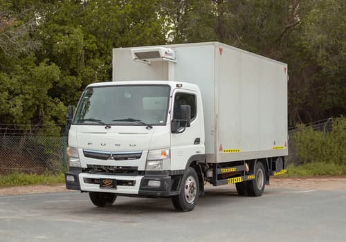 Used 2023 Mitsubishi Canter Chiller Box in White – Left Front Diagonal (45°) View for Sale at First Choice Cars Dubai Sharjah