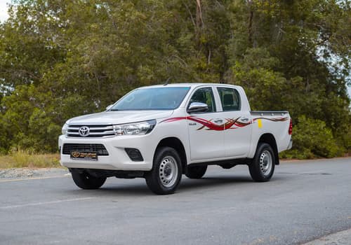 Used 2021 Toyota Hilux GLX Double Cabin in White – Left Front Diagonal (45°) View for Sale at First Choice Cars Dubai Sharjah