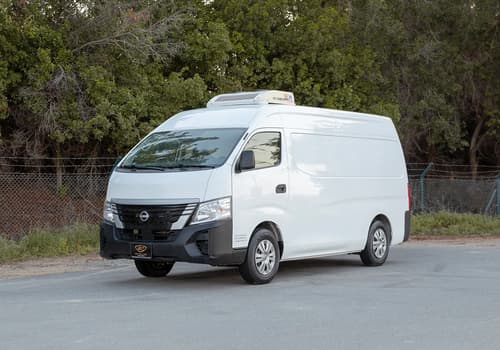 Used 2023 Nissan Urvan High Roof in White – Left Front Diagonal (45°) View for Sale at First Choice Cars Dubai Sharjah