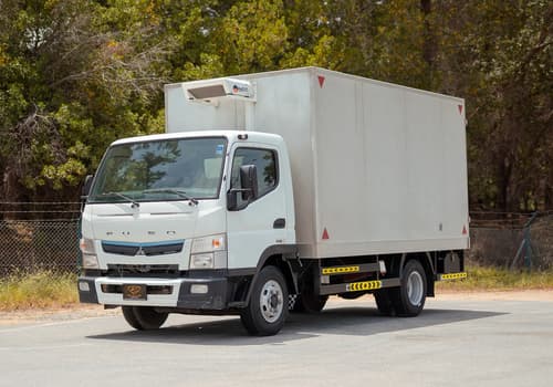 Used 2020 Mitsubishi Canter Chiller Box in White – Left Front Diagonal (45°) View for Sale at First Choice Cars Dubai Sharjah